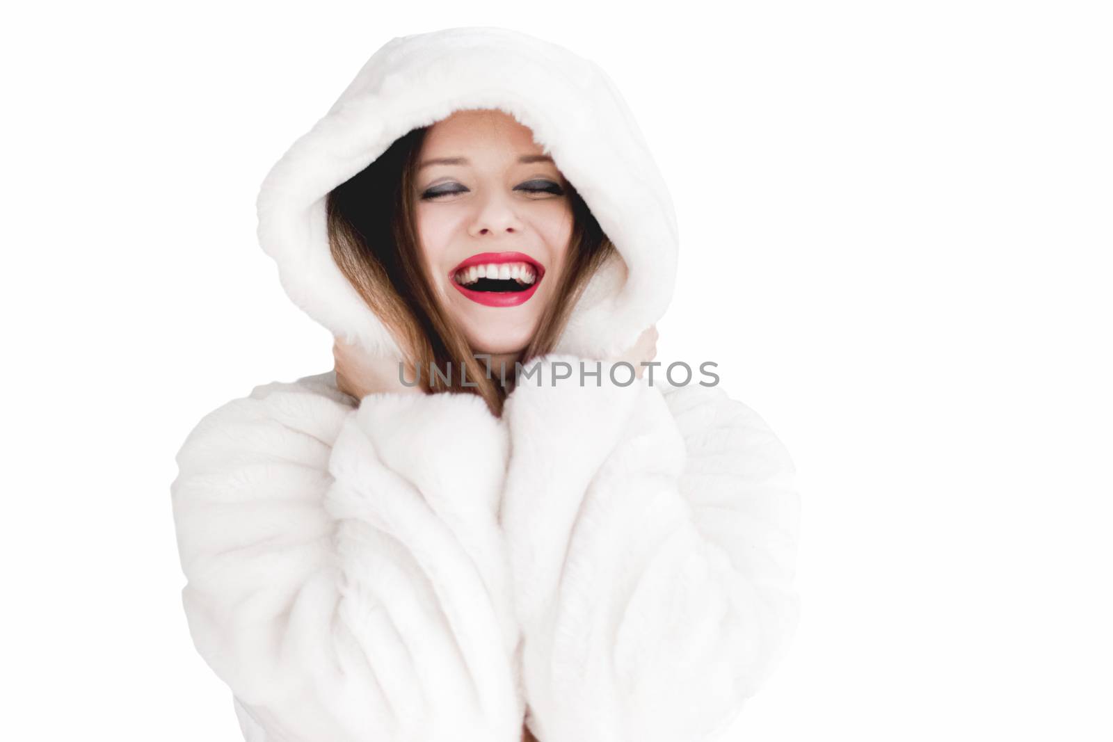 Young woman in fluffy fur coat with hood wrap, warm winter cloth by Anneleven