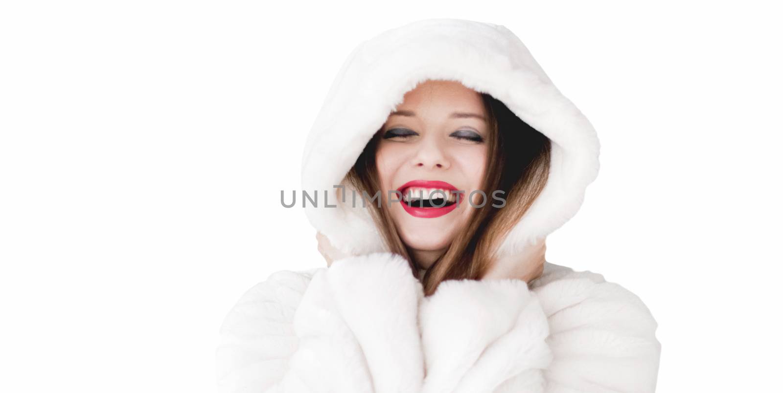 Young woman in fluffy fur coat with hood wrap, warm winter clothing for fashion and Christmas holidays design