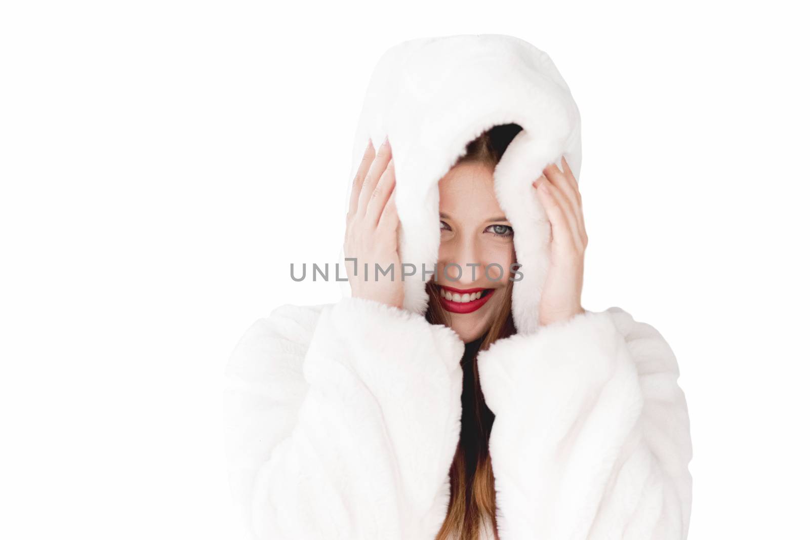 Young woman in fluffy fur coat with hood wrap, warm winter clothing for fashion and Christmas holidays design