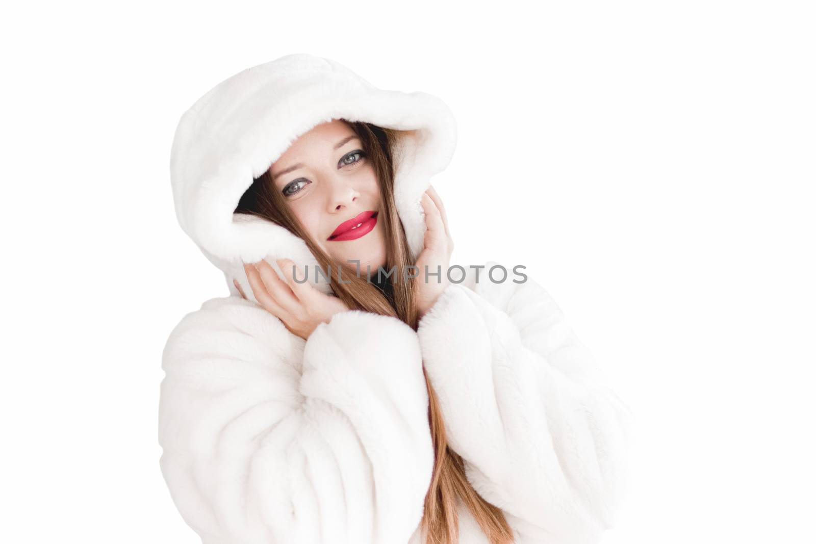 Young woman in fluffy fur coat with hood wrap, warm winter clothing for fashion and Christmas holidays design