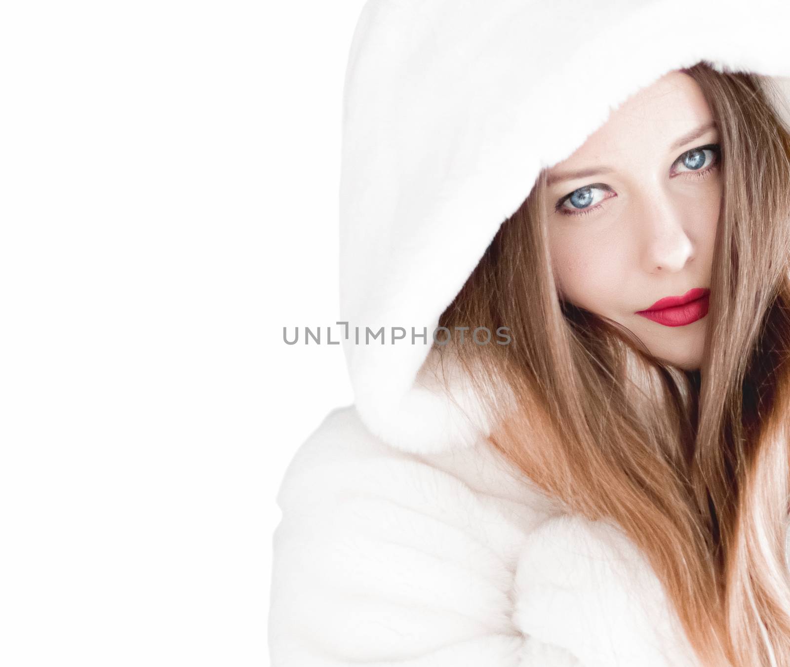 Young woman in fluffy fur coat with hood wrap, warm winter cloth by Anneleven