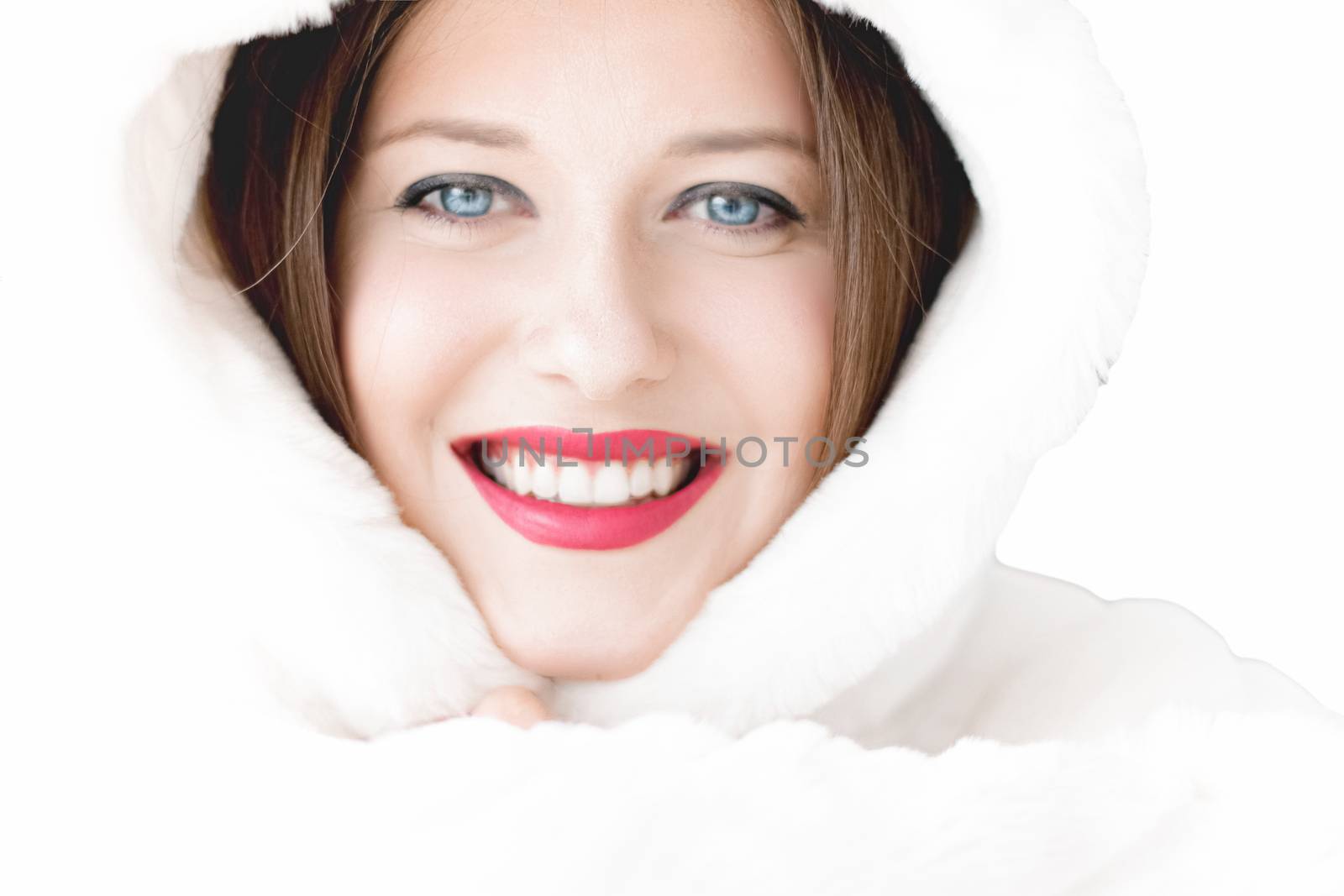 Young woman in fluffy fur coat with hood wrap, warm winter cloth by Anneleven