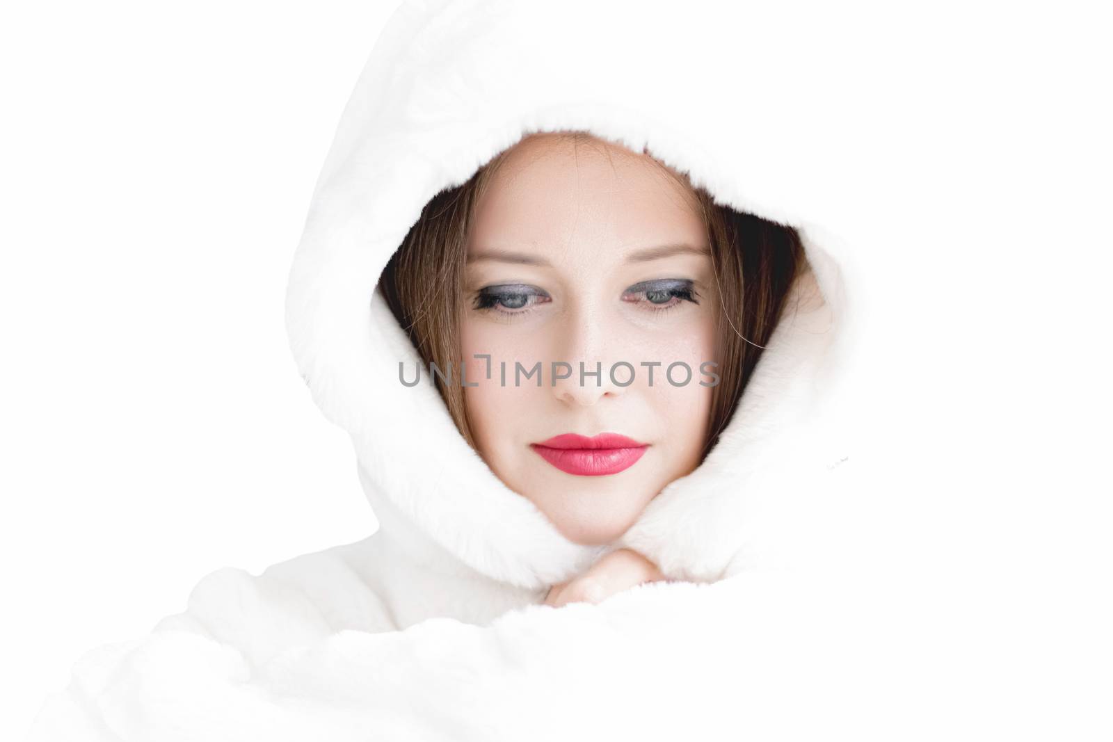 Young woman in fluffy fur coat with hood wrap, warm winter clothing for fashion and Christmas holidays design