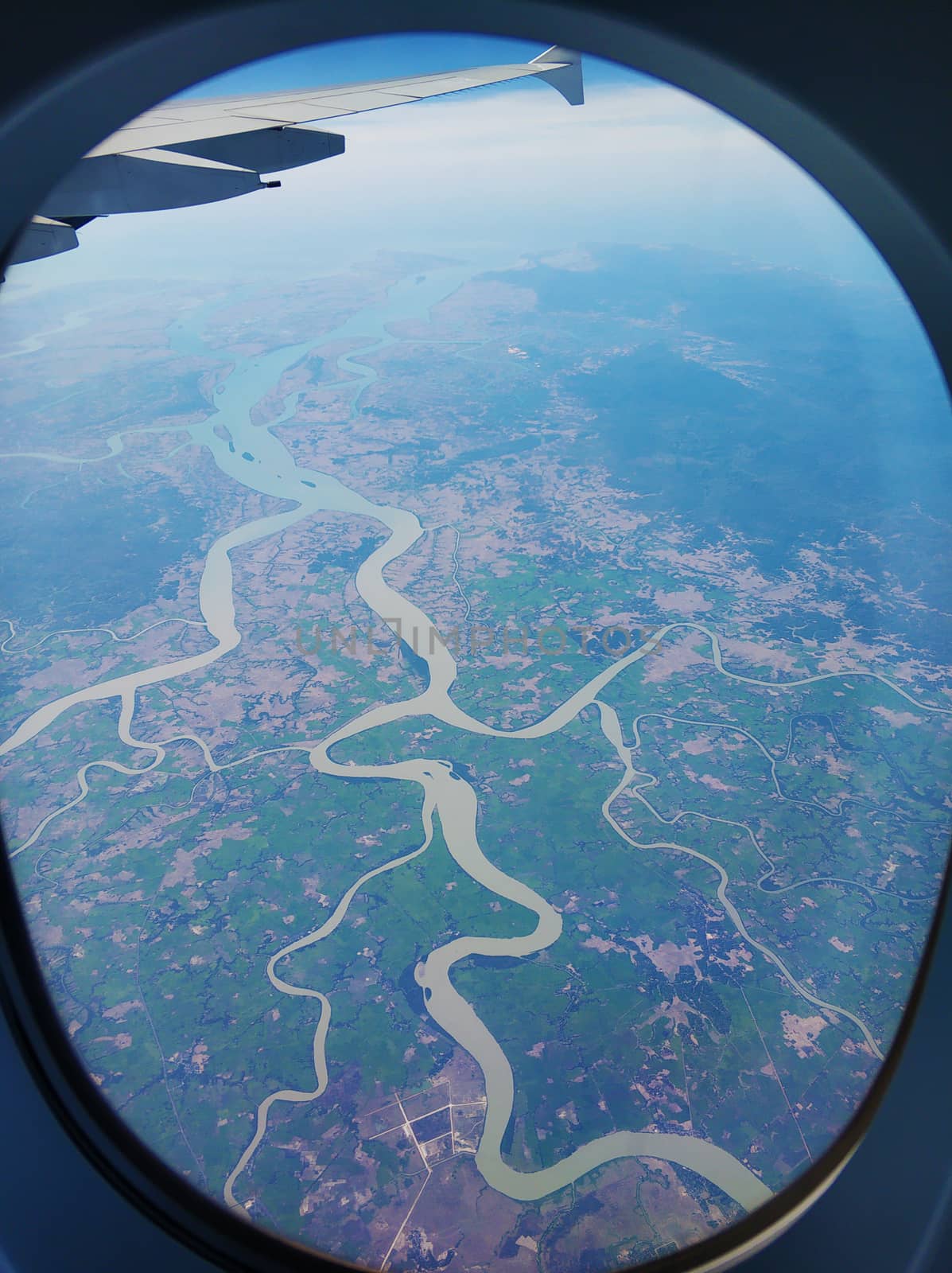 The view from the airplane window to the ground. Landscape view from the sky.