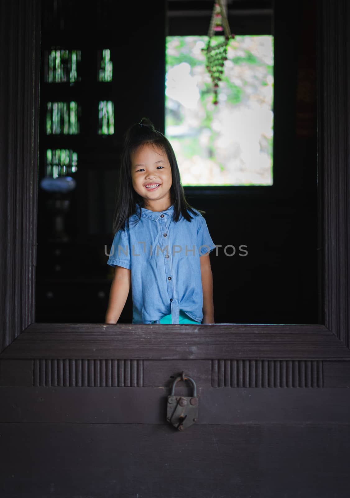 little girl smiling in the door by domonite