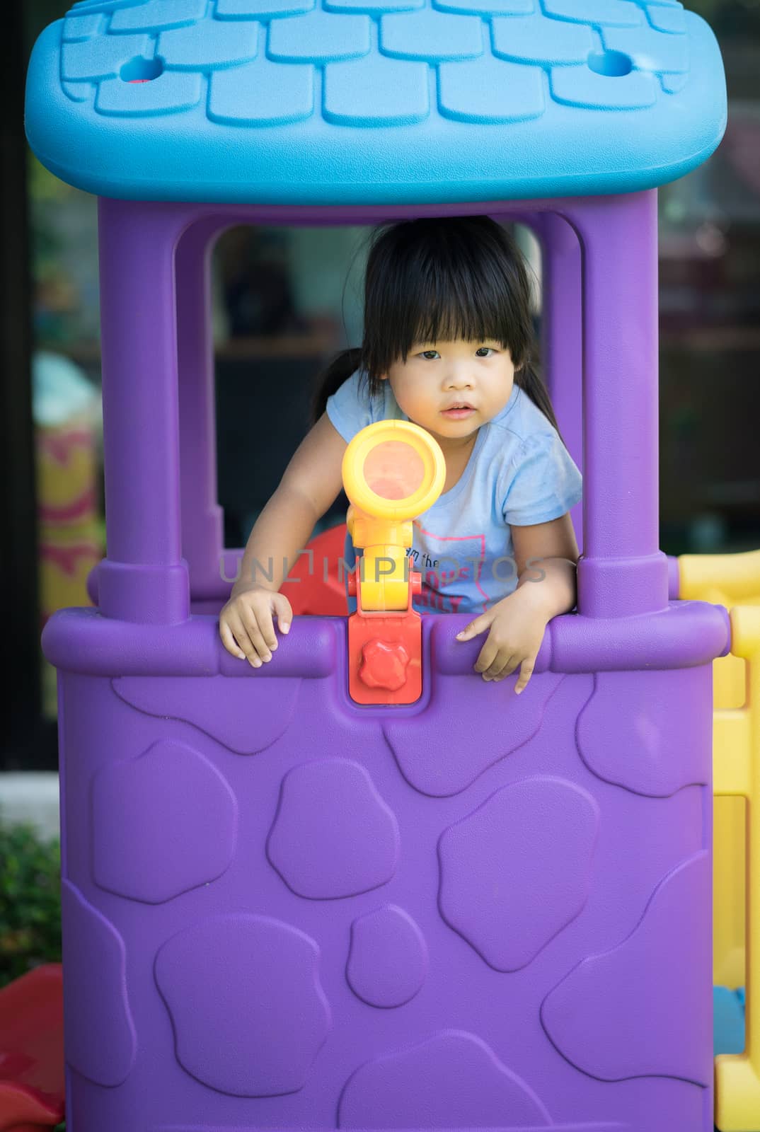 little girl having fun to play in the playground