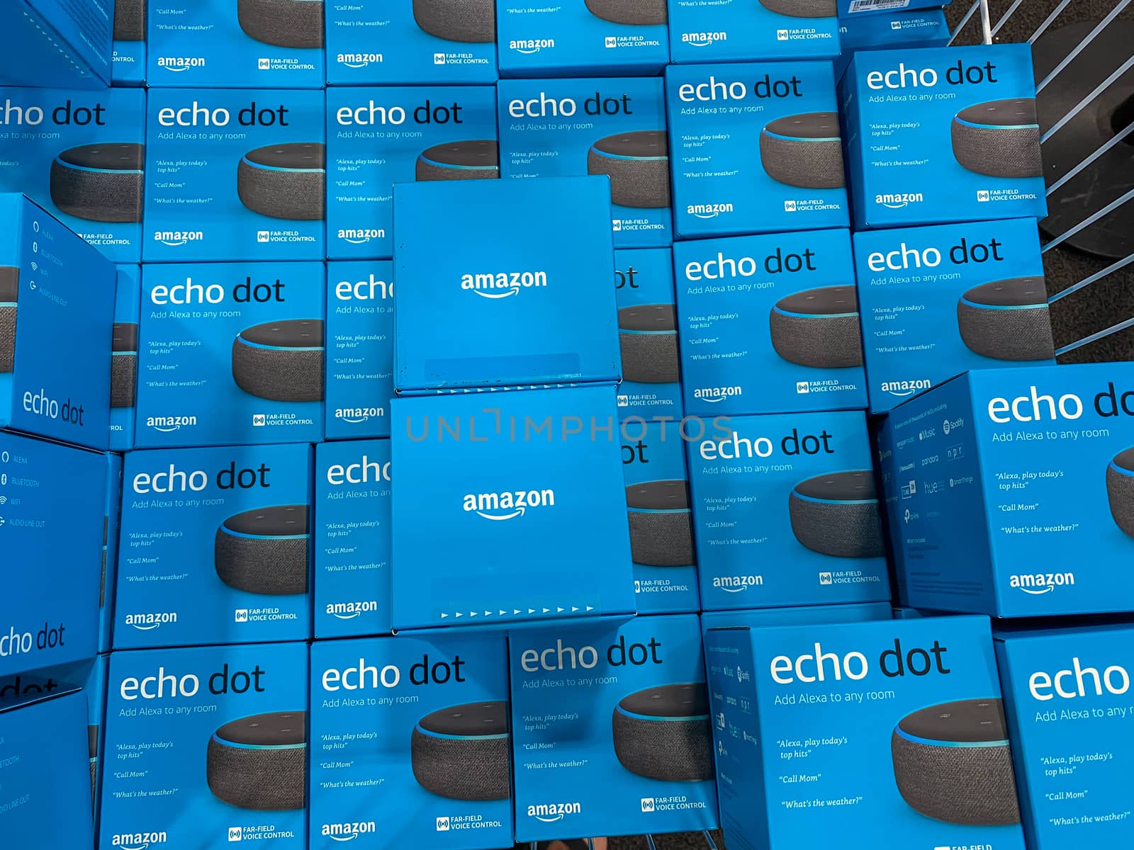 Orlando, FL/USA-10/14/20: Boxes of Amazon Echo Dot virtural assistants for sale in a display bin in a Best Buy chain electronics retail store.