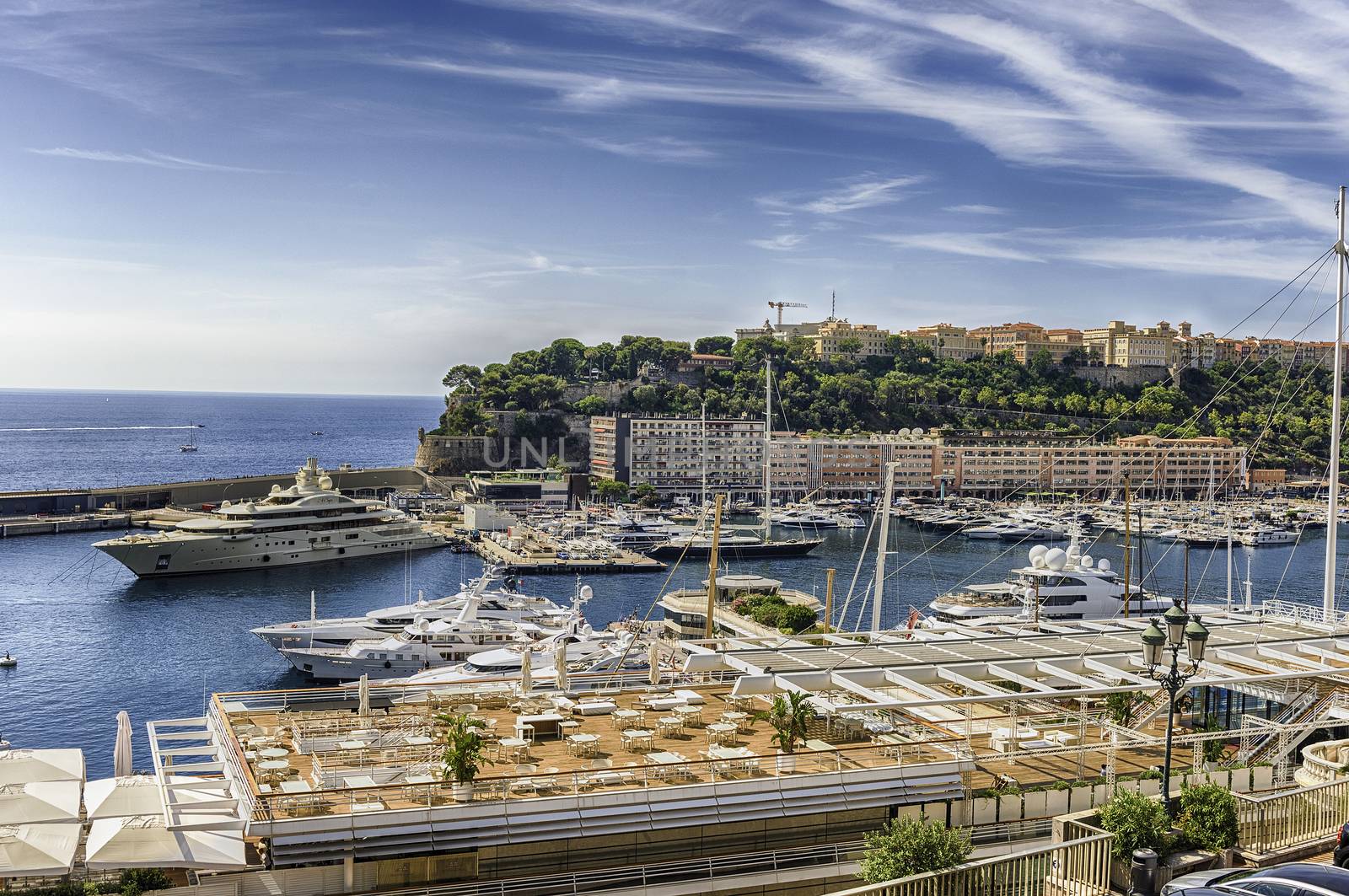 View over luxury yachts and apartments in Monte Carlo, Monaco by marcorubino