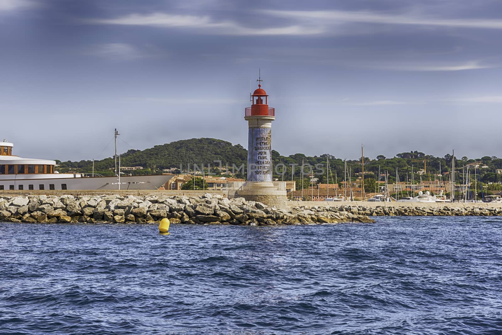 Iconic lighthouse in the harbor of Saint-Tropez, Cote d'Azur, Fr by marcorubino