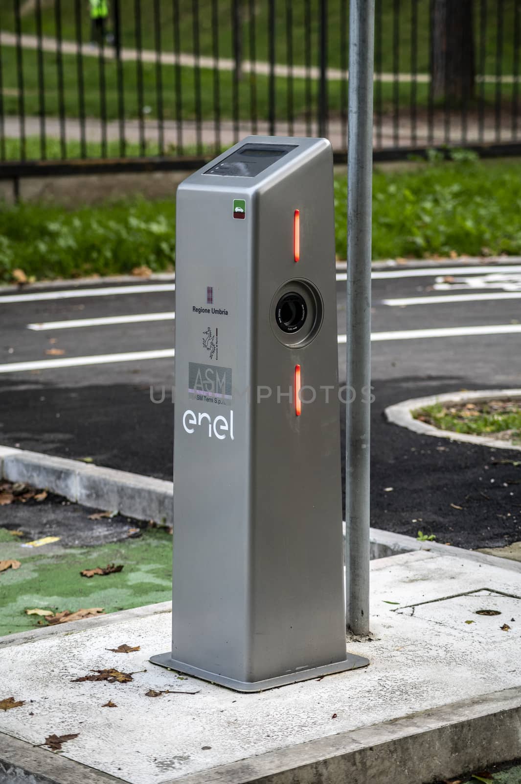 column for charging electric car located in the city by carfedeph