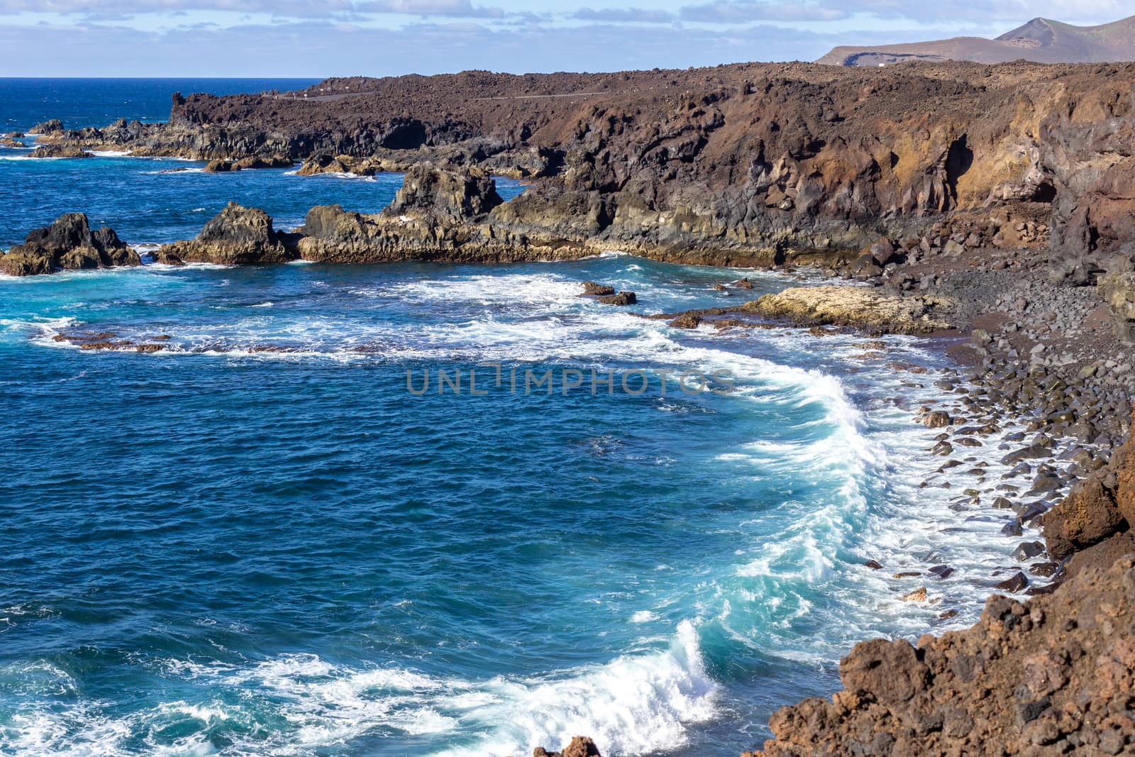 Rocky coastline Los Hervideros in the south west of canary islan by reinerc