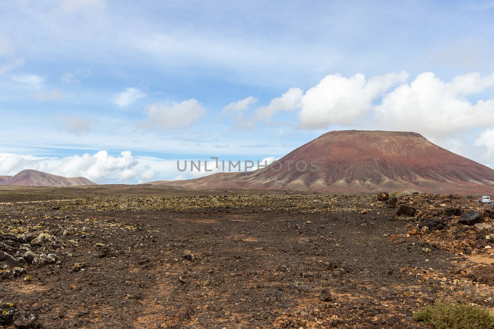 Scenic view at the volcanic landscape in the natural park of Corralejo (Parque Natural De Corralejo) on canary island Fuerteventura, Spain 