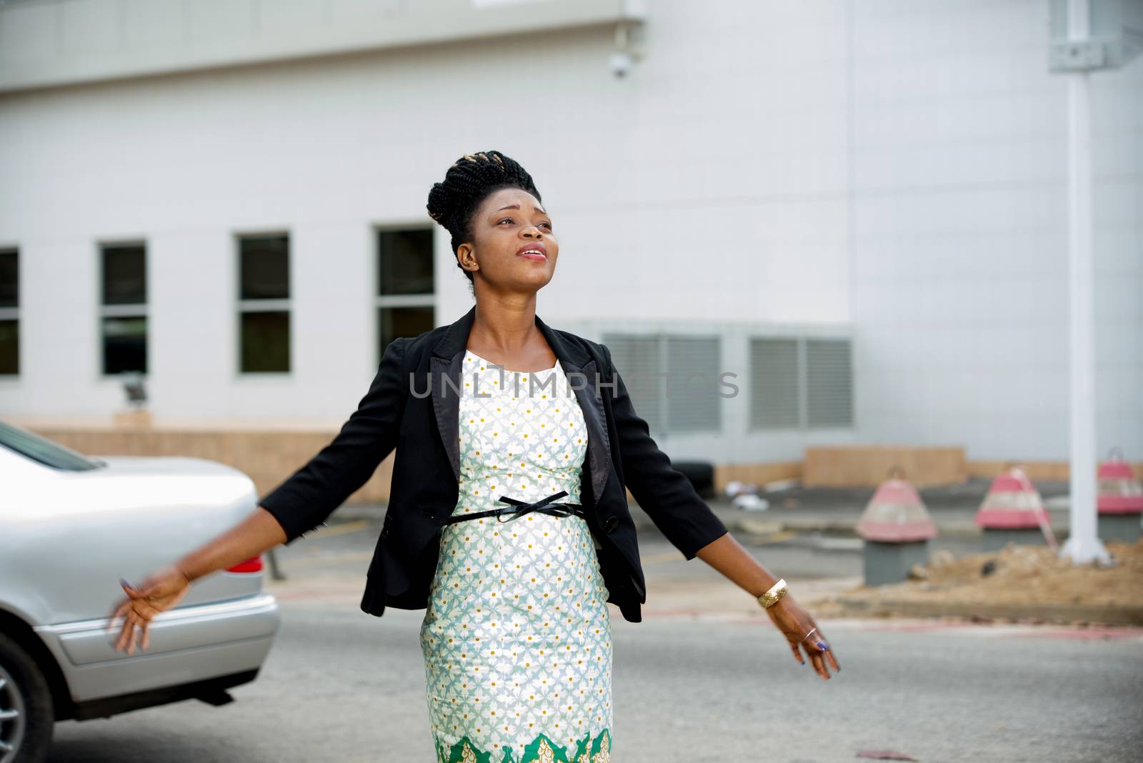 Happy and free business woman in town enjoying success after work.Concept of pleasure of freedom and success