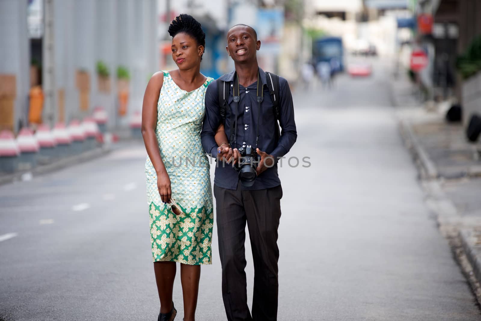 tourist couple walking in the city and observing cultural place to take a picture