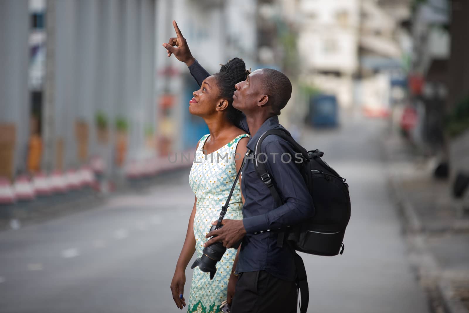 tourist couple walking in the city and observing cultural place to take a picture