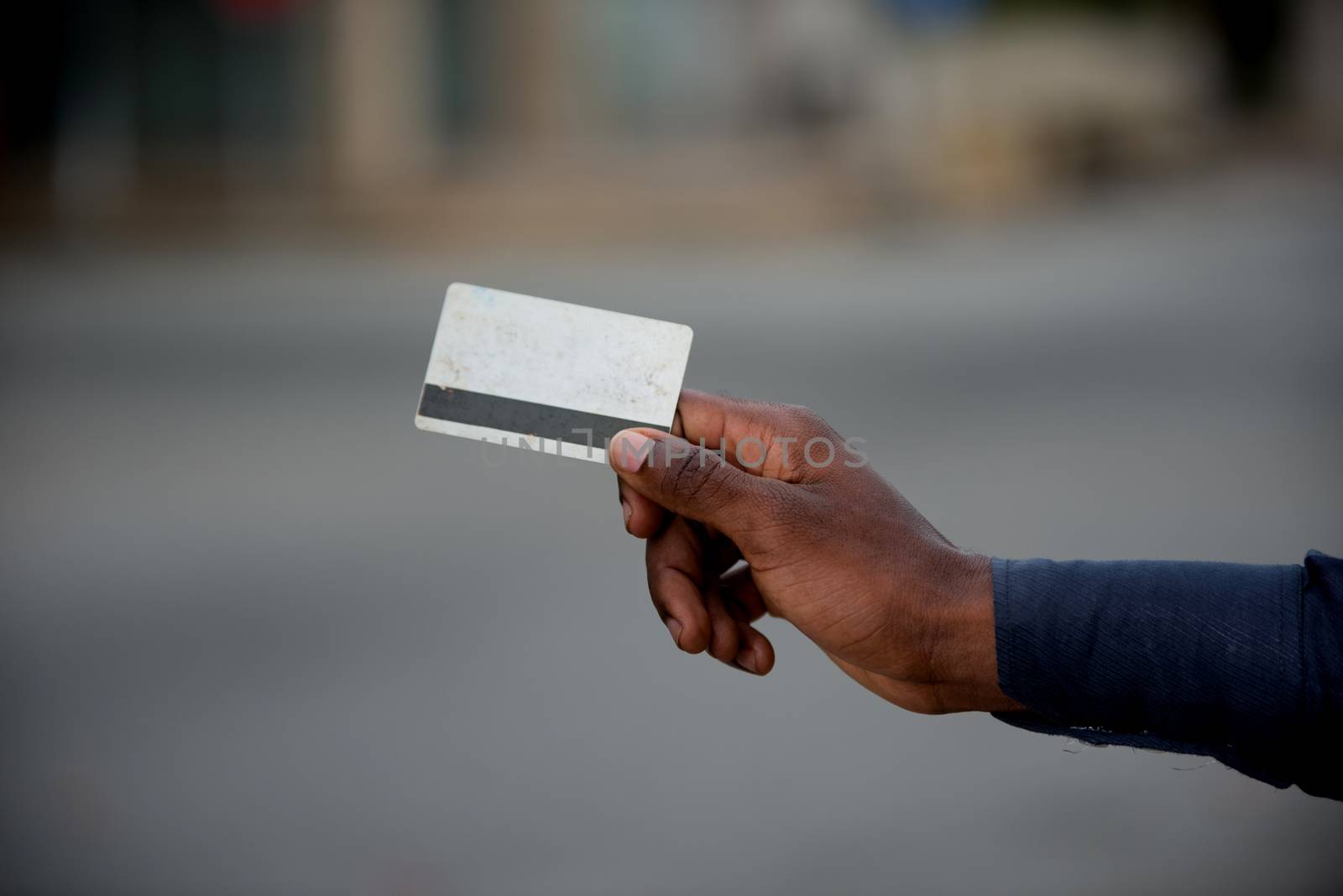 hand of man holding a credit card