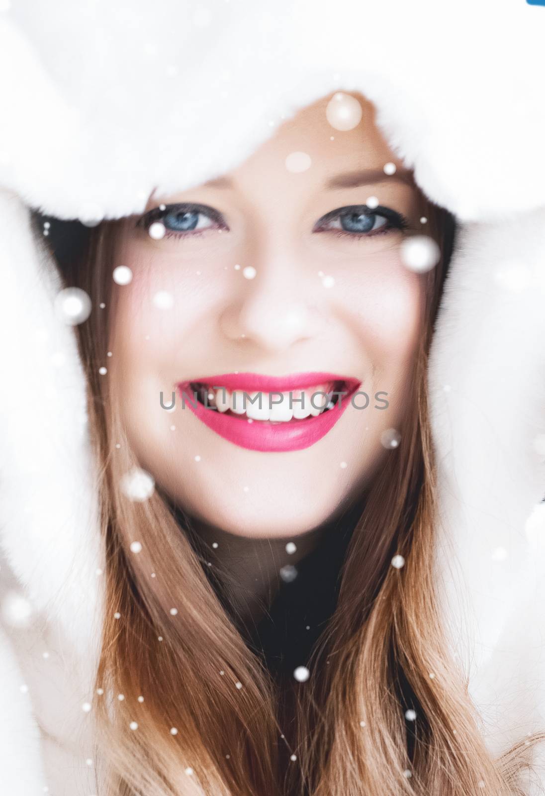 Happy Christmas and winter holiday portrait of young woman in wh by Anneleven