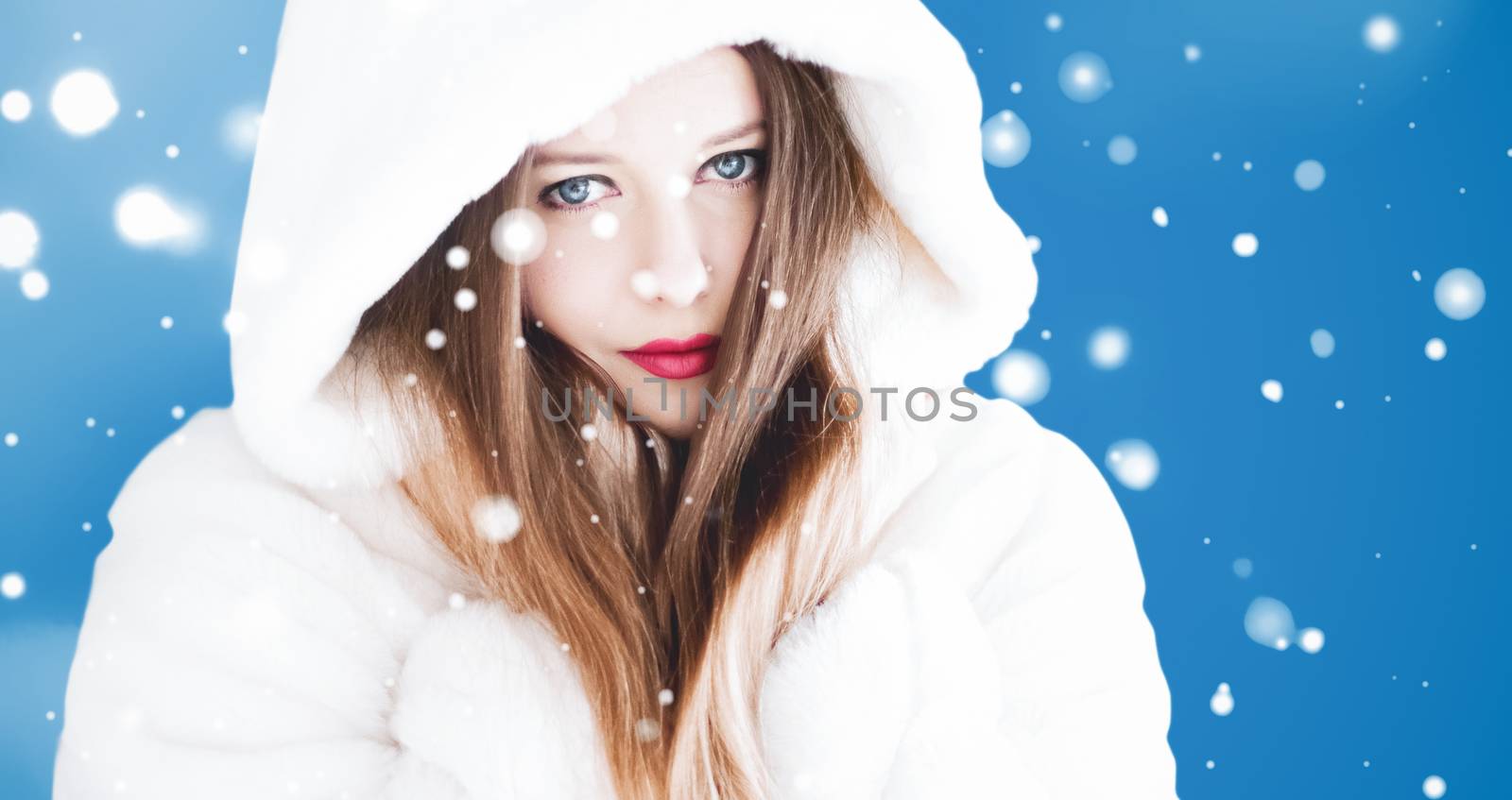 Happy Christmas and winter holiday portrait of young woman in wh by Anneleven