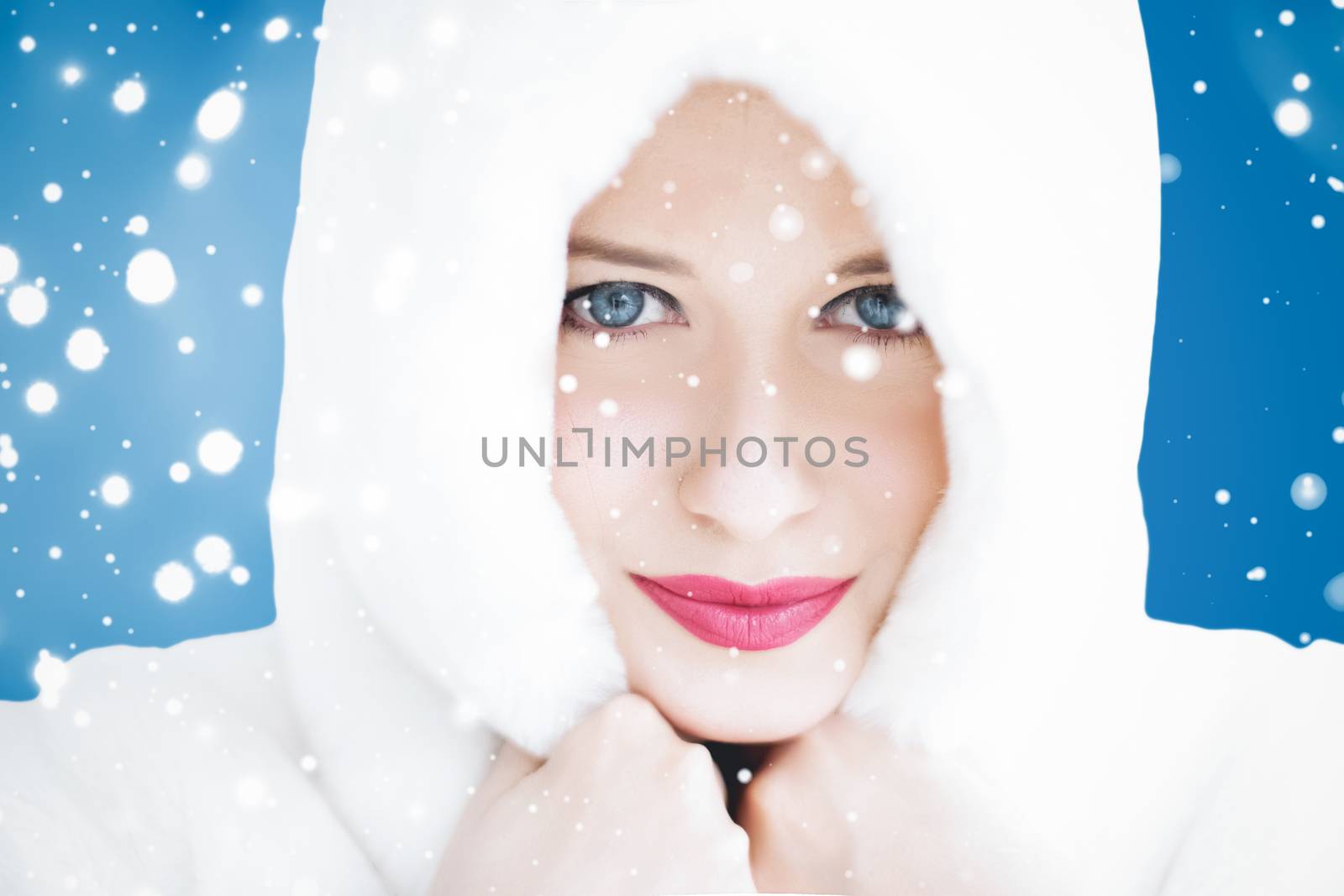 Happy Christmas and winter holiday portrait of young woman in wh by Anneleven