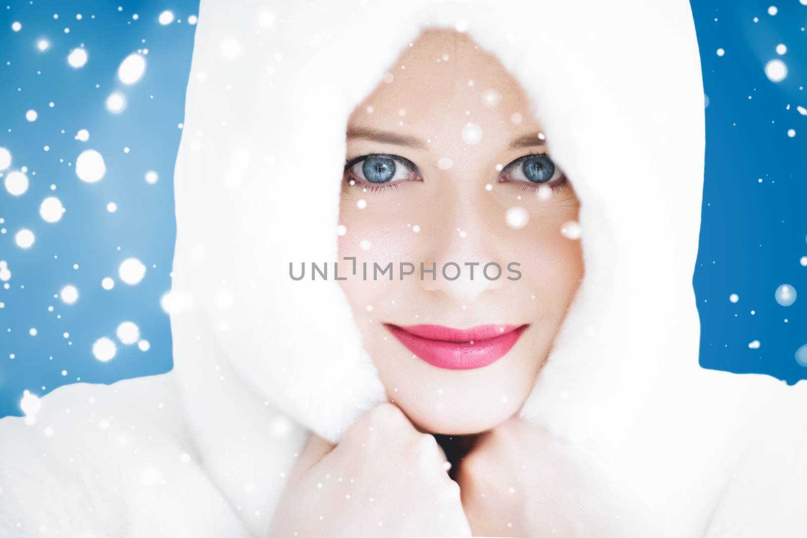 Happy Christmas and winter holiday portrait of young woman in wh by Anneleven