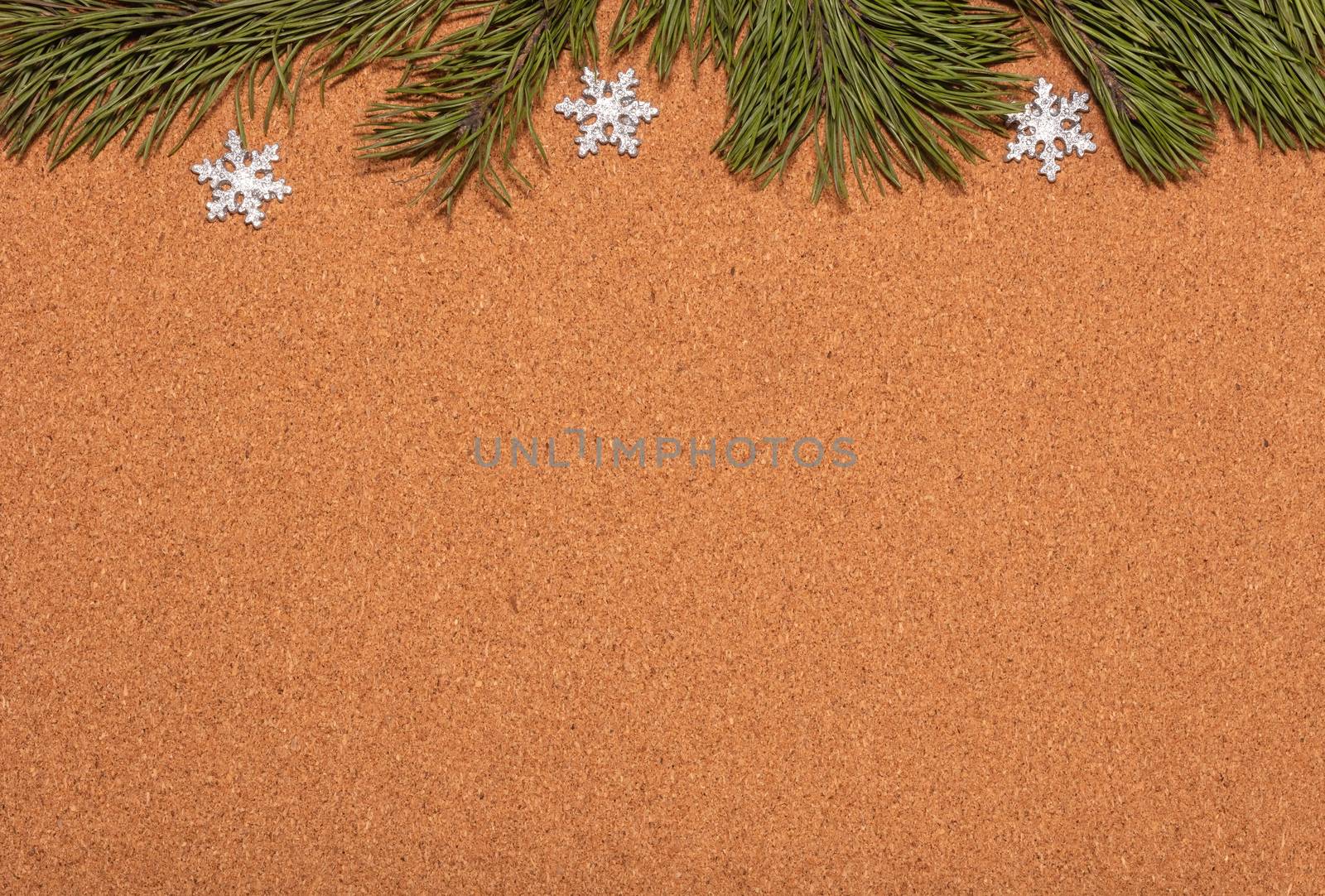 Empty corkwood notice board decorated with pine twigs and snowflakes. Christmas, new years celebration season, business concept. by DamantisZ