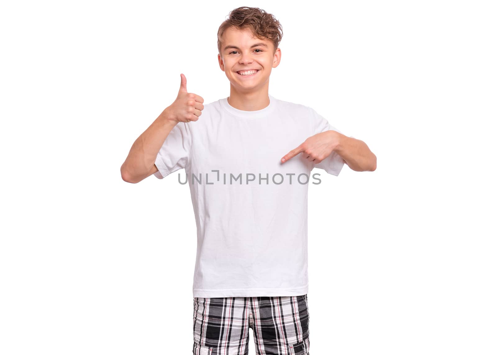 Cute teen boy pointing up, gesturing idea or doing number one gesture, isolated on white background