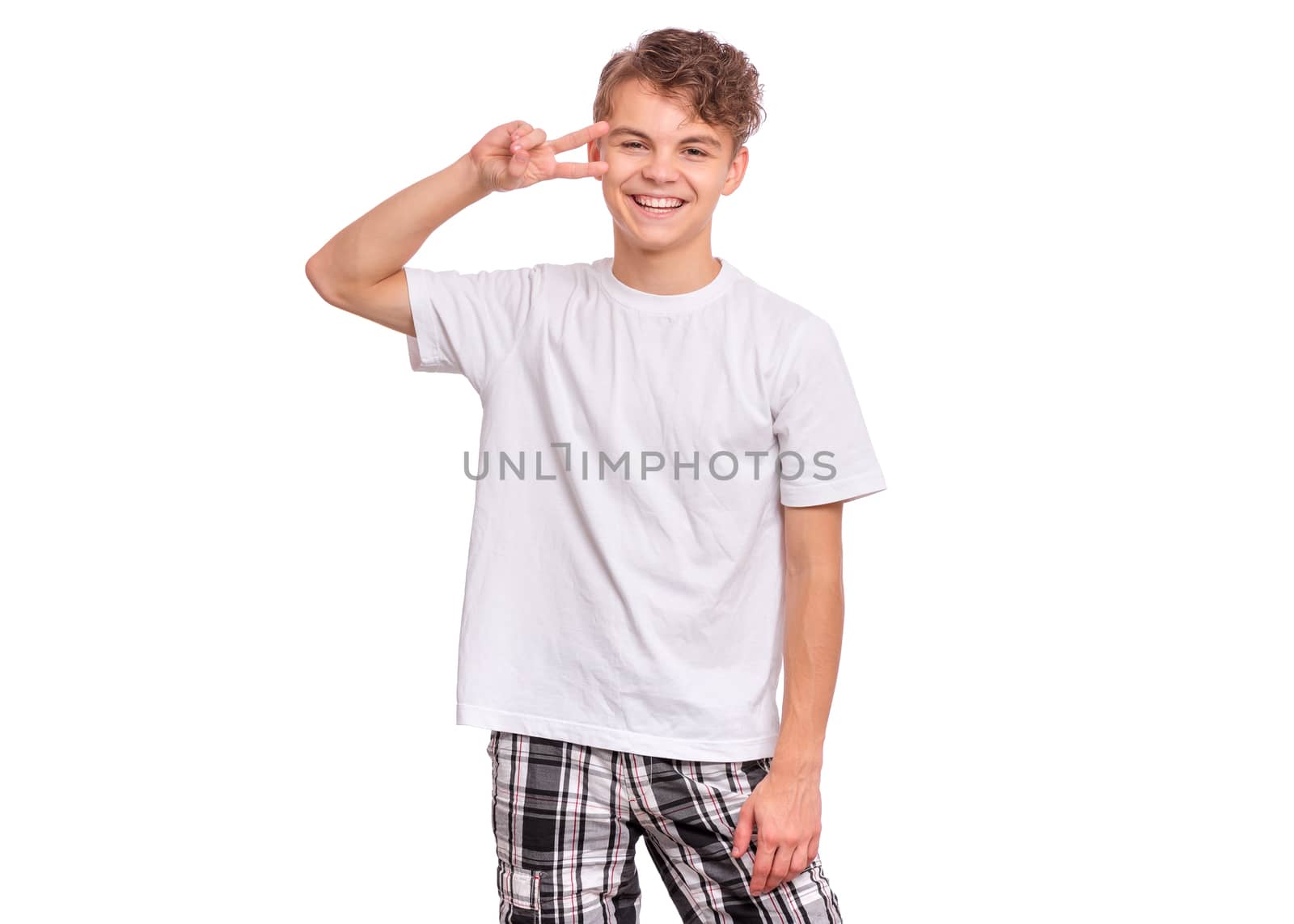 Handsome teen boy laughing looking very happy, isolated on white background