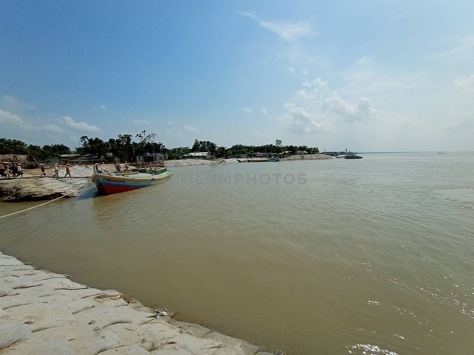 river and sky view with boat and nature