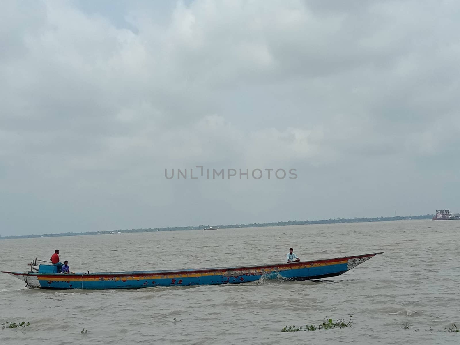 wooden fishing boat on river with sky