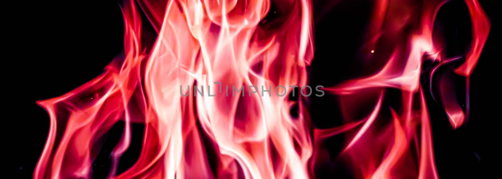 Red fire flames as nature element and abstract background by Anneleven