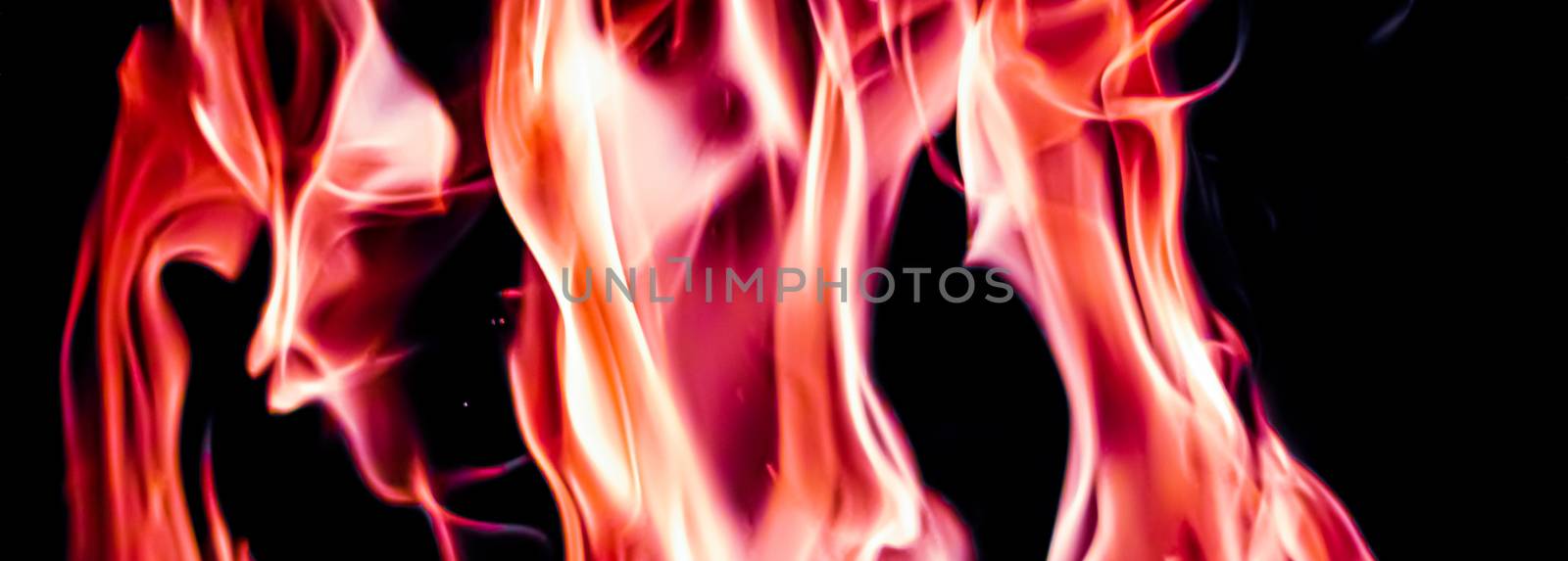 Red fire flames as nature element and abstract background by Anneleven