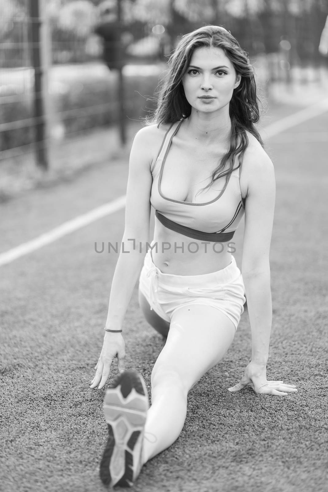 Brunette girl doing sports exercises in the morning