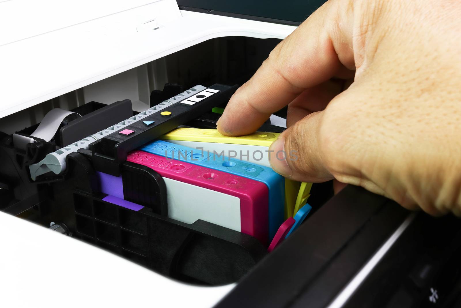 Technicians are install setup the ink cartridge of a inkjet printer the device of office automate for printing