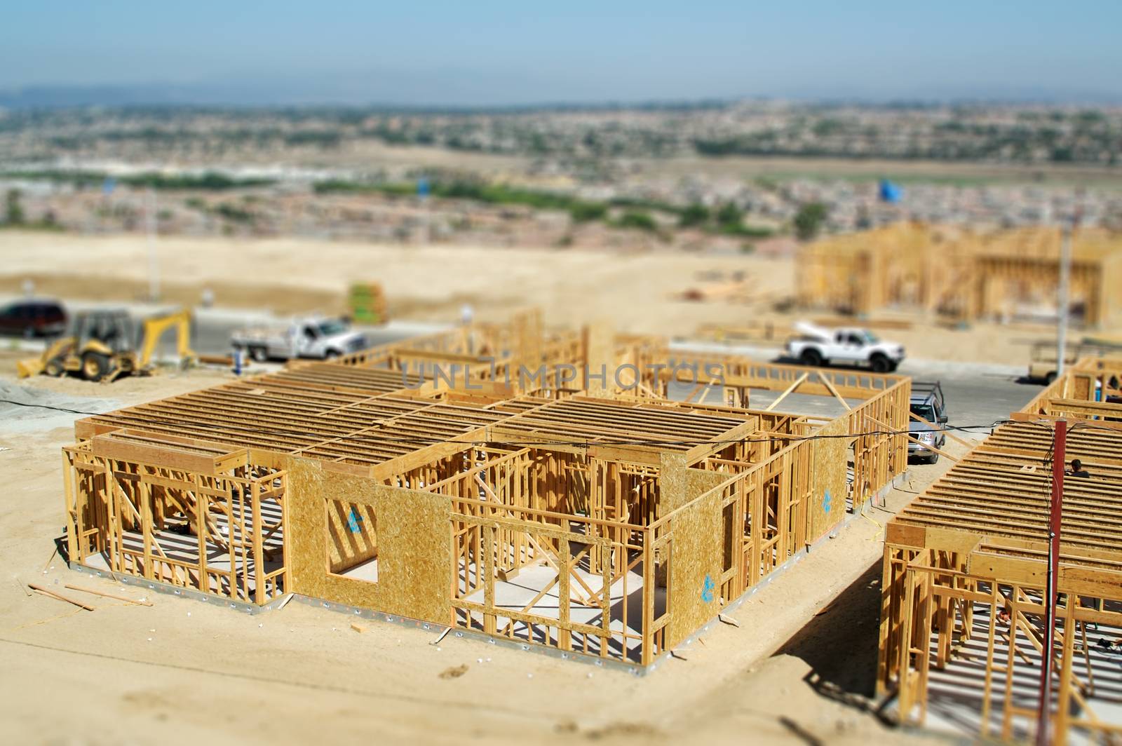 Aerial View of New Homes Construction Site with Tilt-Shift Blur.