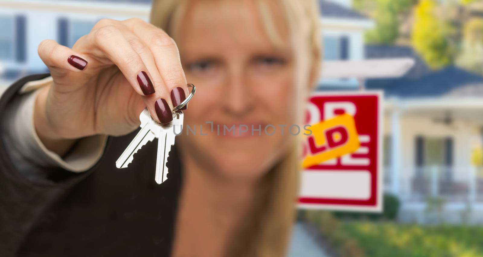 Real Estate Agent Handing Over New House Keys with Sold Sign Beh by Feverpitched