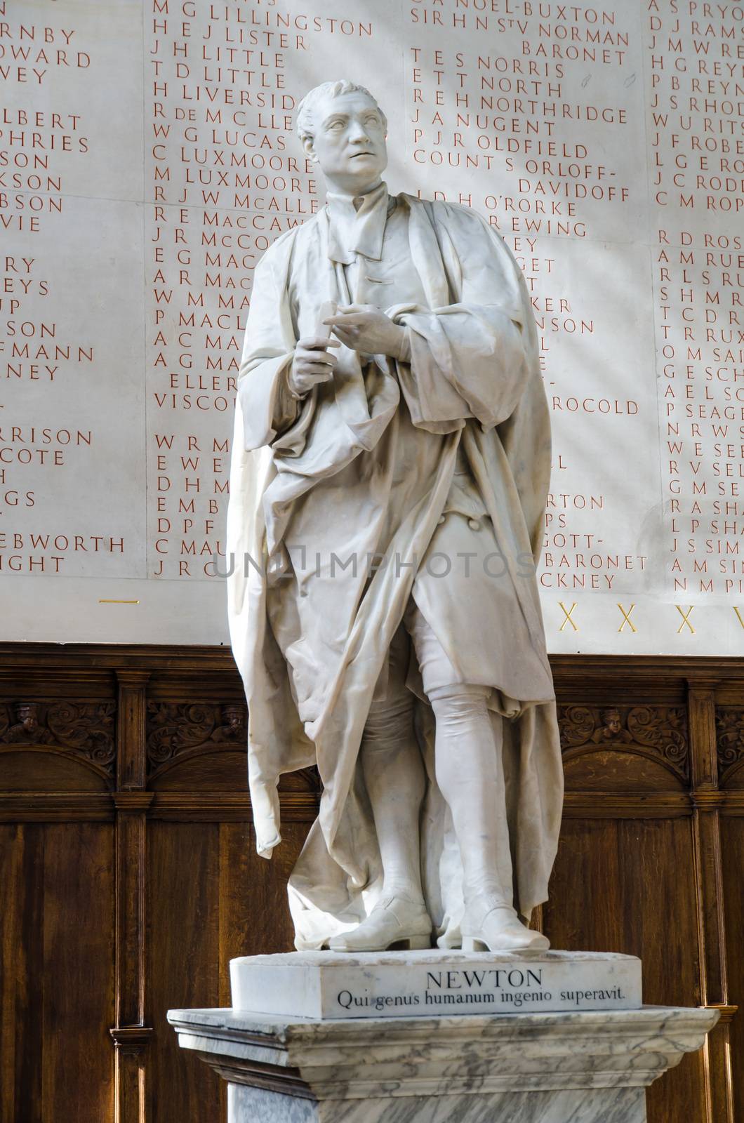 Cambridge, UK - 04 2015: Isaac Newton statue illuminated by sun rays by mauricallari