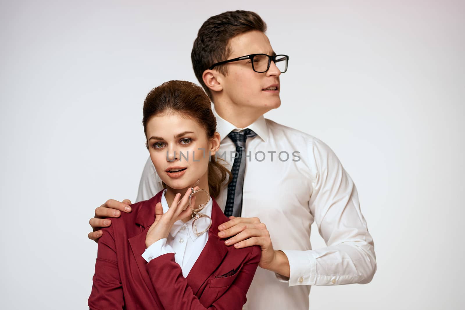 Work colleagues Business couple office officials team studio light background by SHOTPRIME