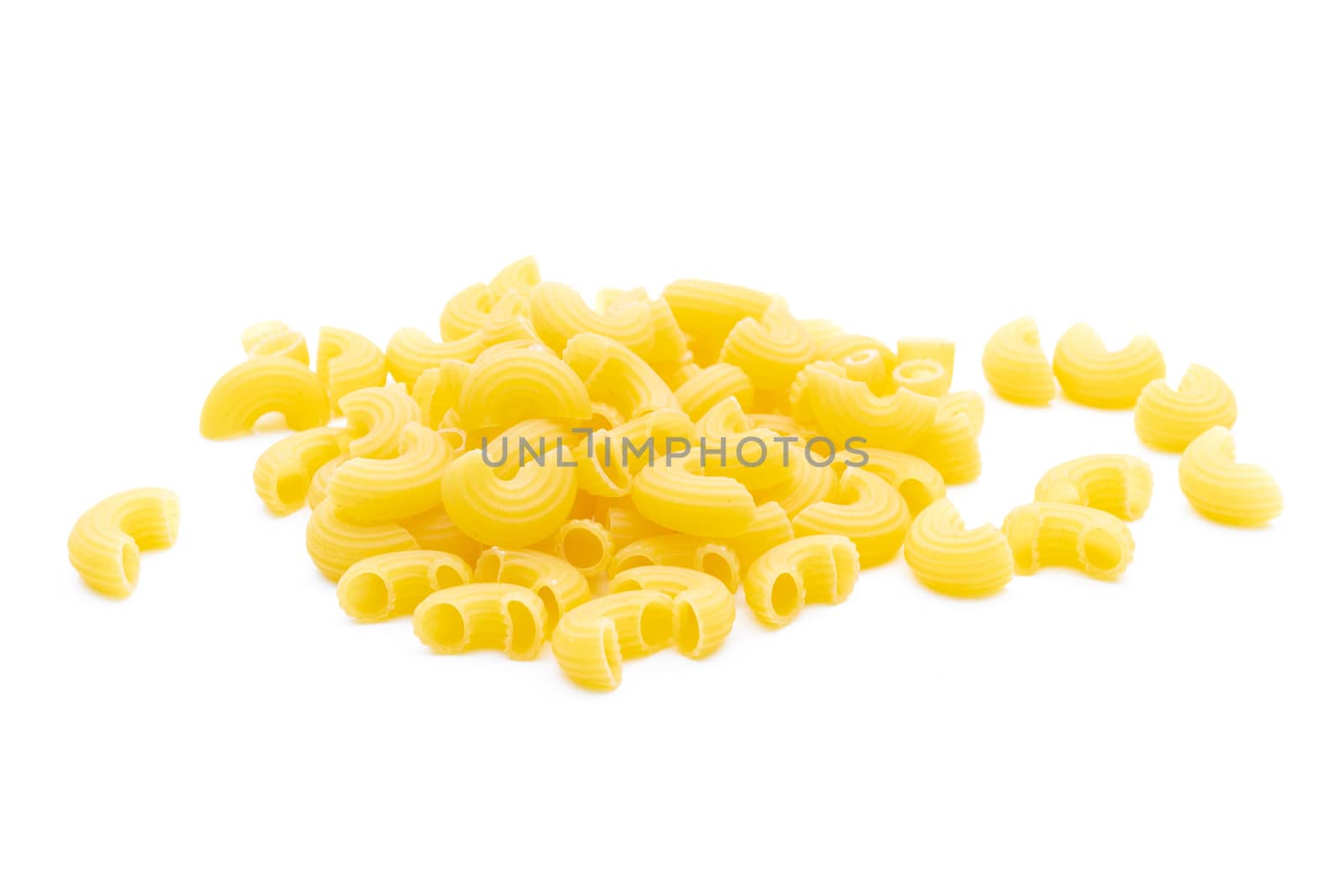 Raw macaroni on white background