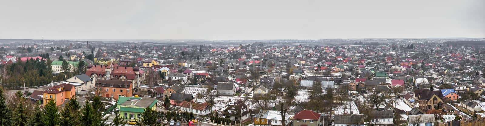 Pochaev, Ukraine 01.04.2020.  Panoramic top view of the Pochaev village from the terrace of Holy Dormition Lavra in Ukraine, on a gloomy winter morning