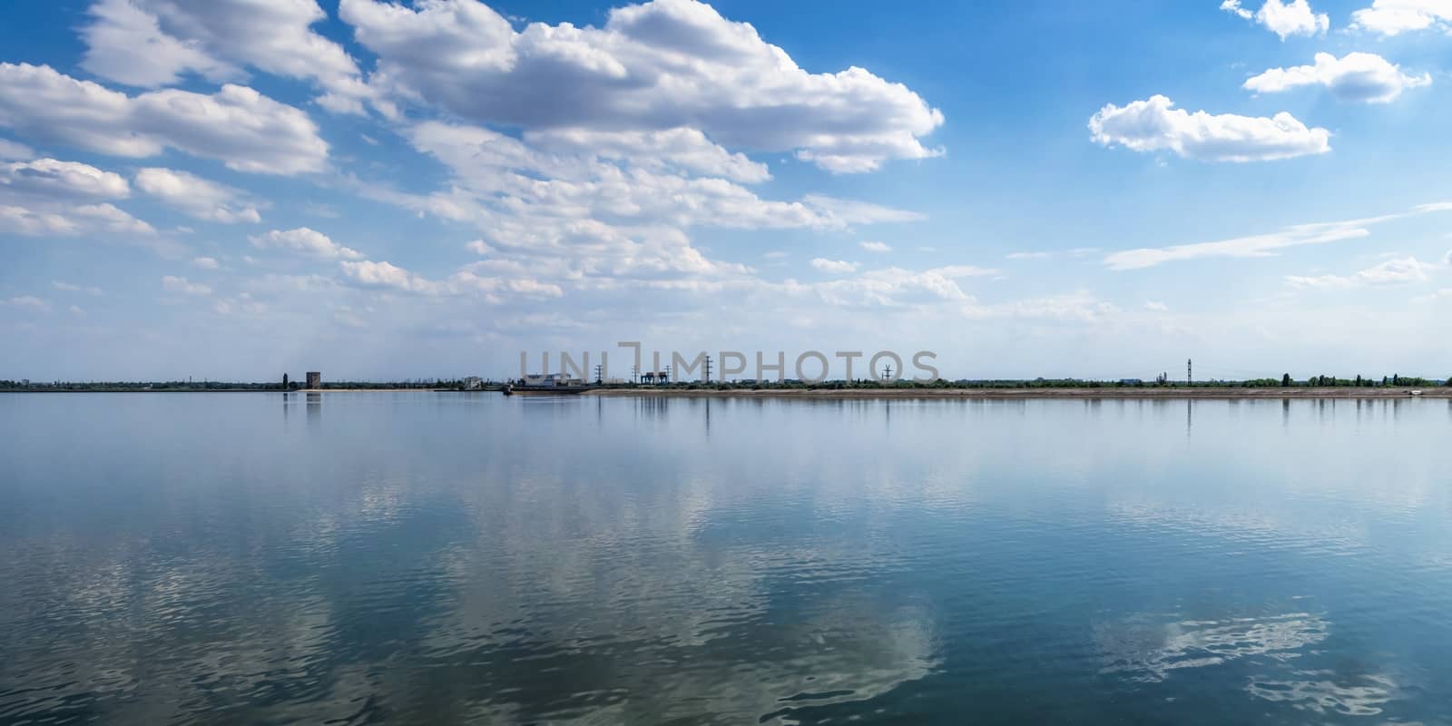 Vesele, Ukraine 07.24.2020. View of the Dnipro river and Kakhovskaya hydroelectric power station from the side of Chateau Trubetskoy in Kherson region, Ukraine, on a sunny summer day