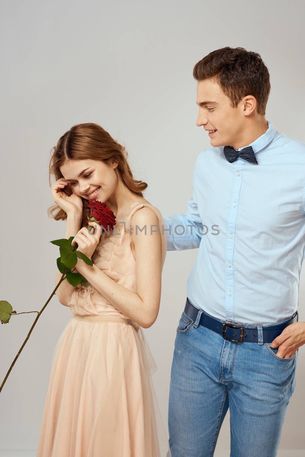 beautiful couple relationship rose gift as romance hug light background. High quality photo