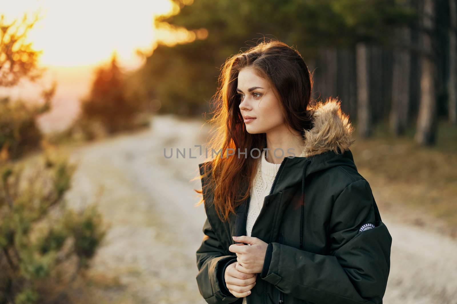 woman in jacket on nature travel outdoors freedom. High quality photo
