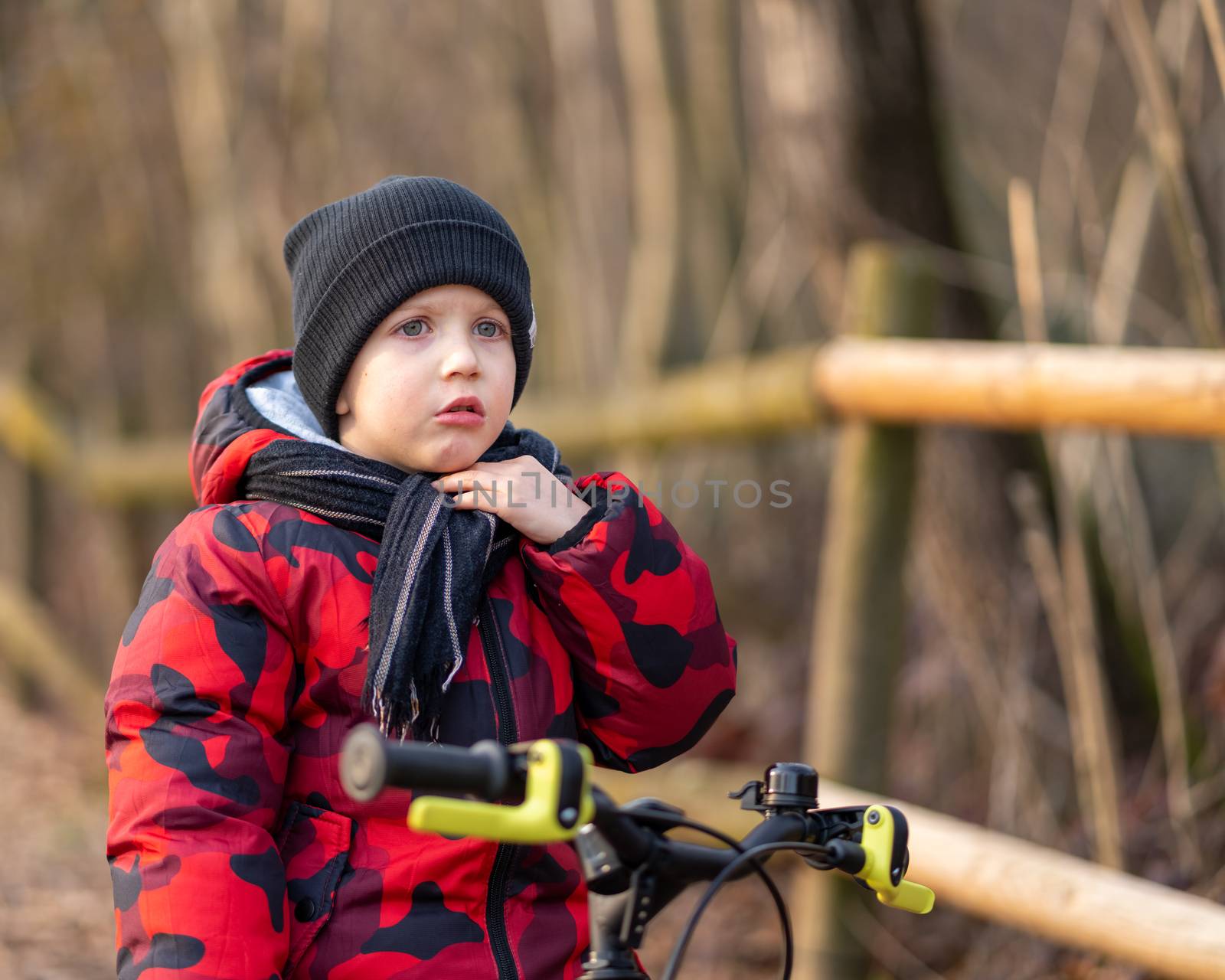 Angry boy on bicycle at park by Robertobinetti70