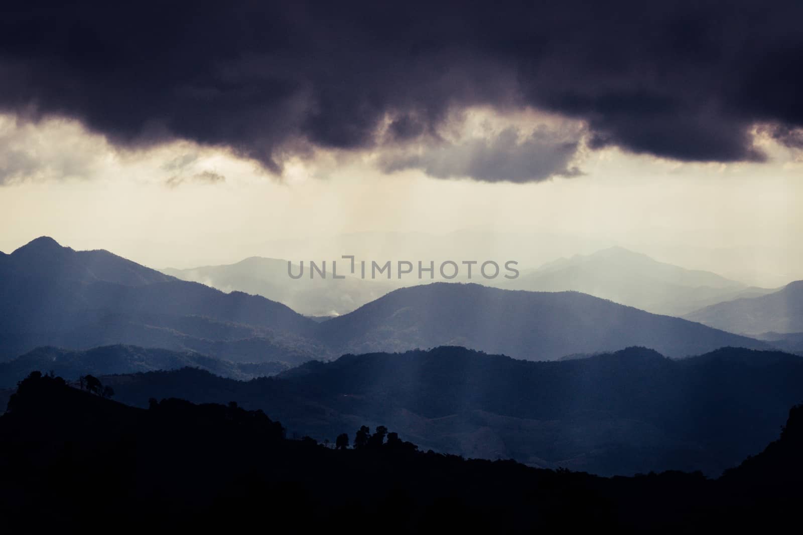 Overlapping mountains and rain clouds