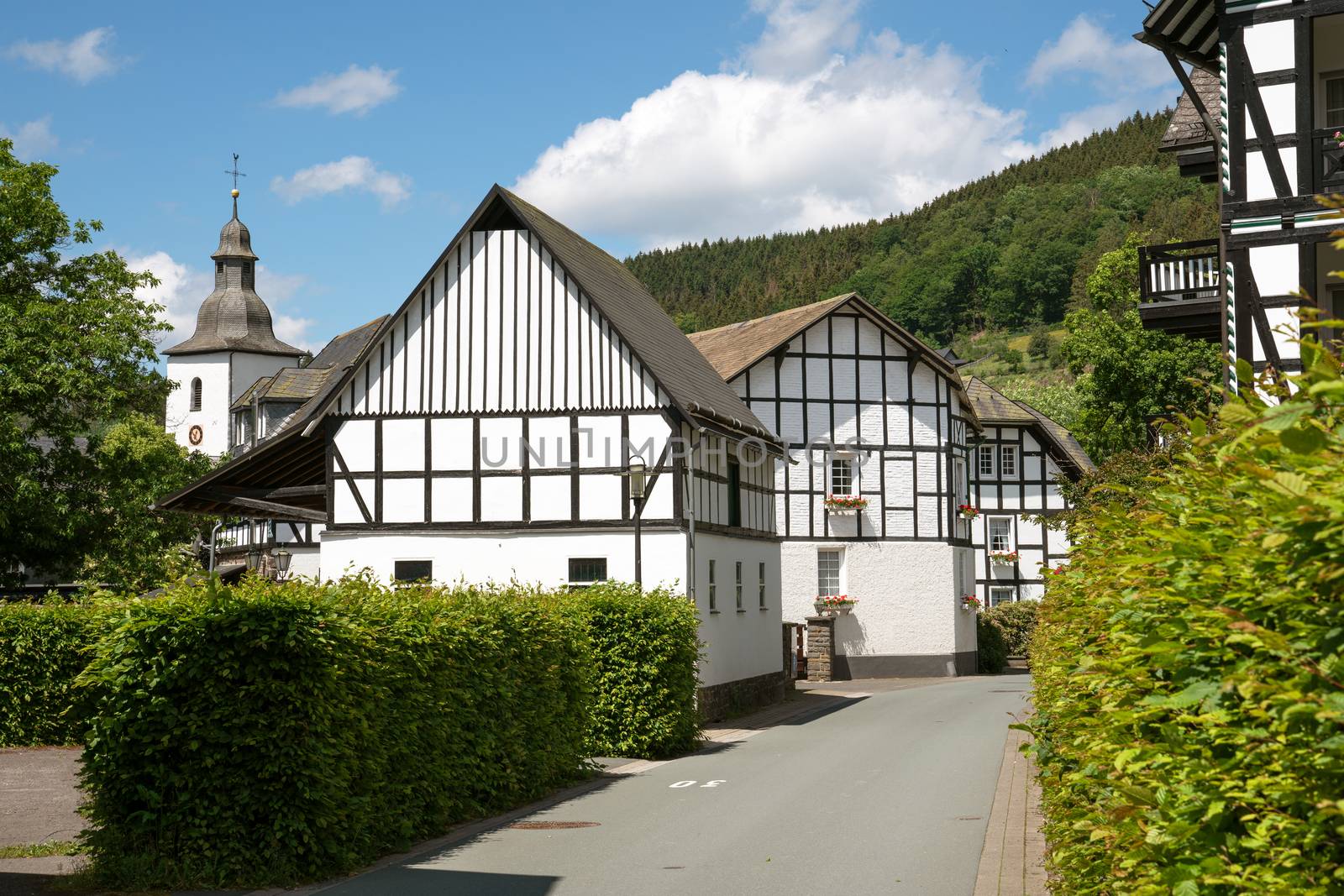 Image of old half-timbered houses against blue sky in summertime, Oberkirchen, Schmallenberg, Sauerland, Germany