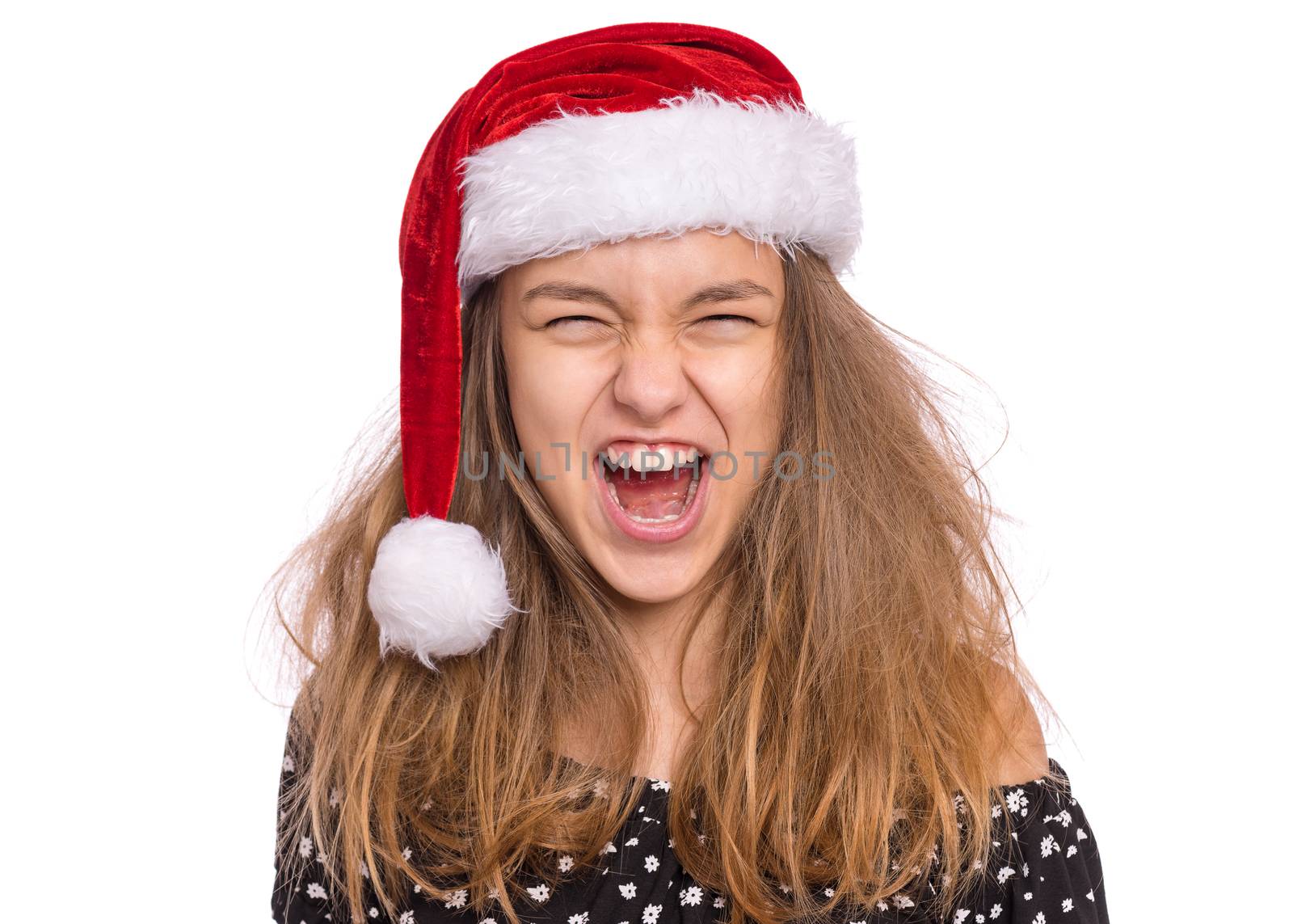 Happy teen girl in Santa red hat, isolated on white background