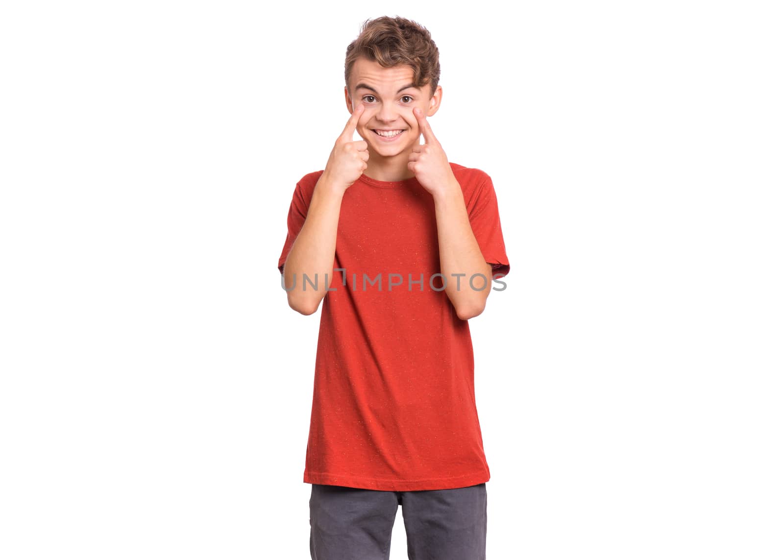 Handsome teen boy showing his eye, isolated on white background