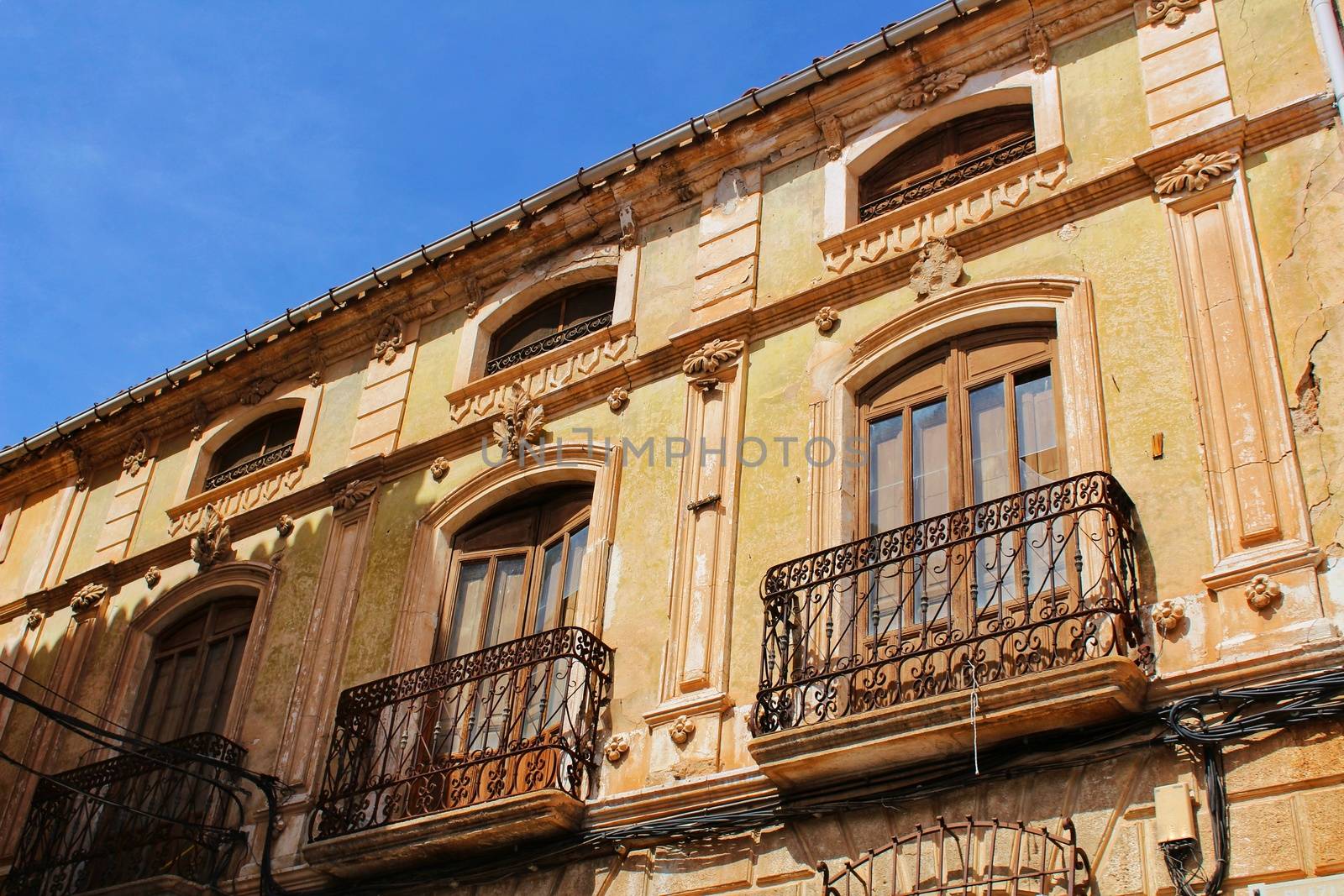 Colorful and majestic old house facade in Caravaca de La Cruz, Murcia, Spain in a sunny day of Spring