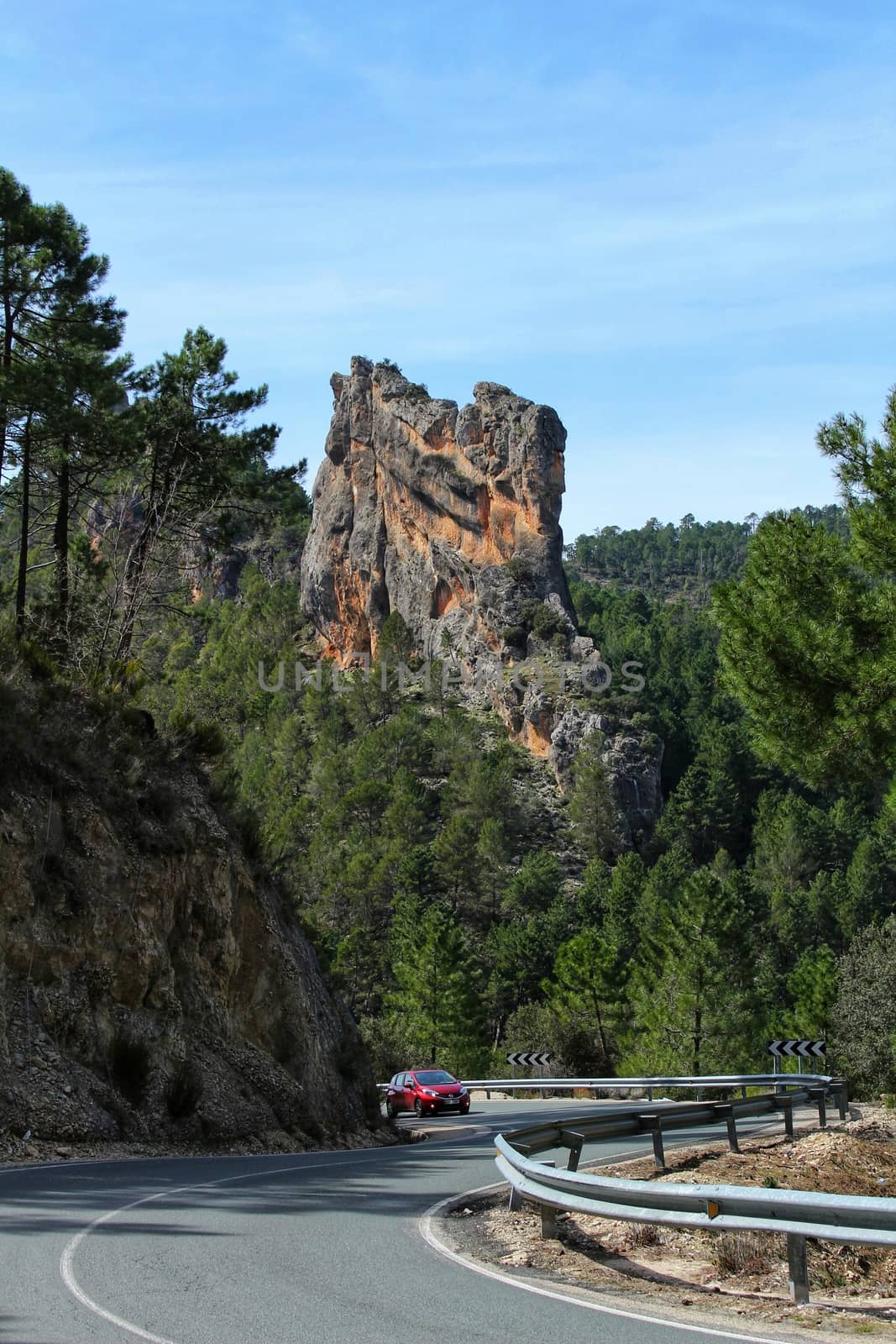 Road between mountains and pine forests in Sierra del Segura, Albacete, Spain.