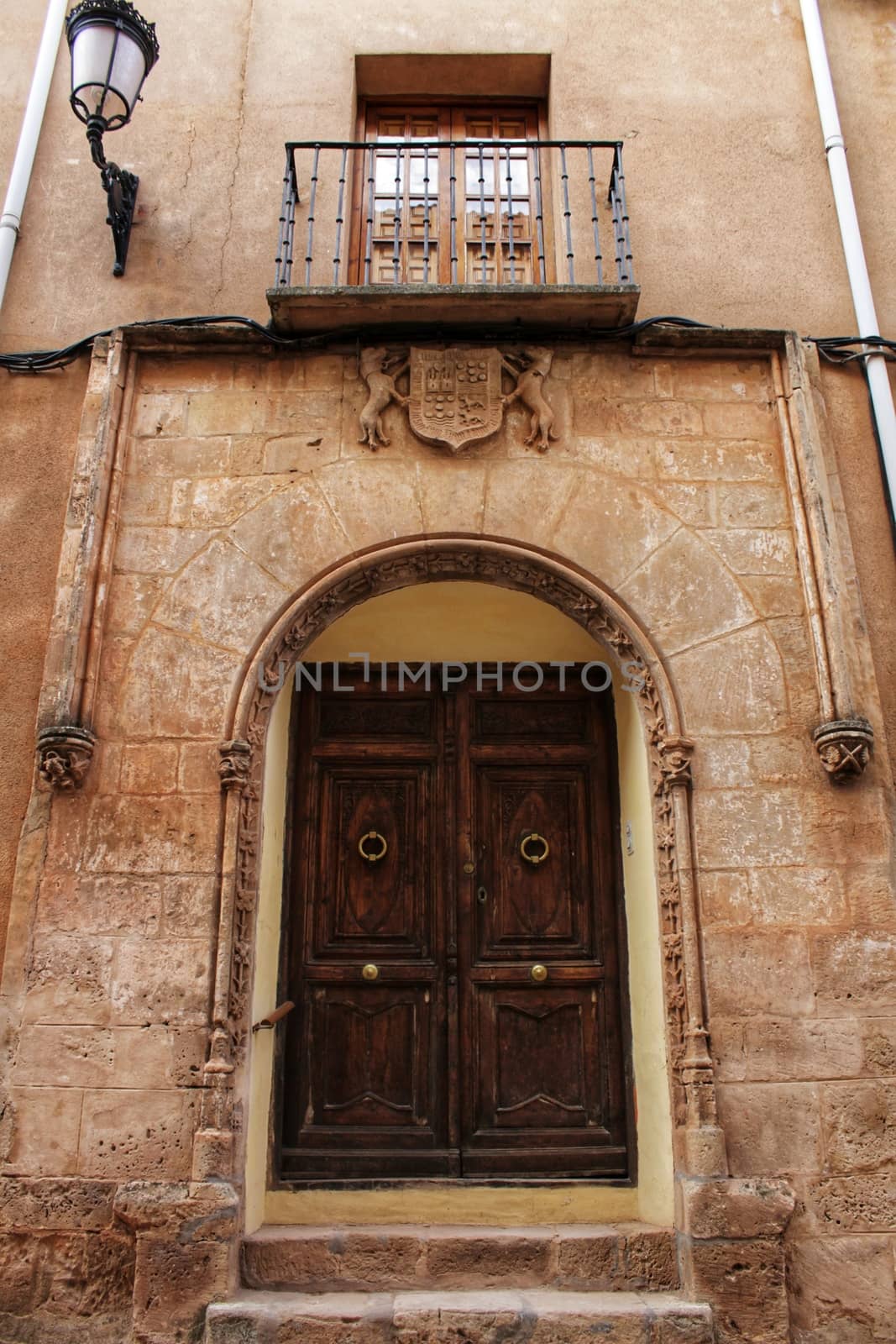 Old facade and entrance of majestic house in Alcaraz, Albacete province, Spain by soniabonet